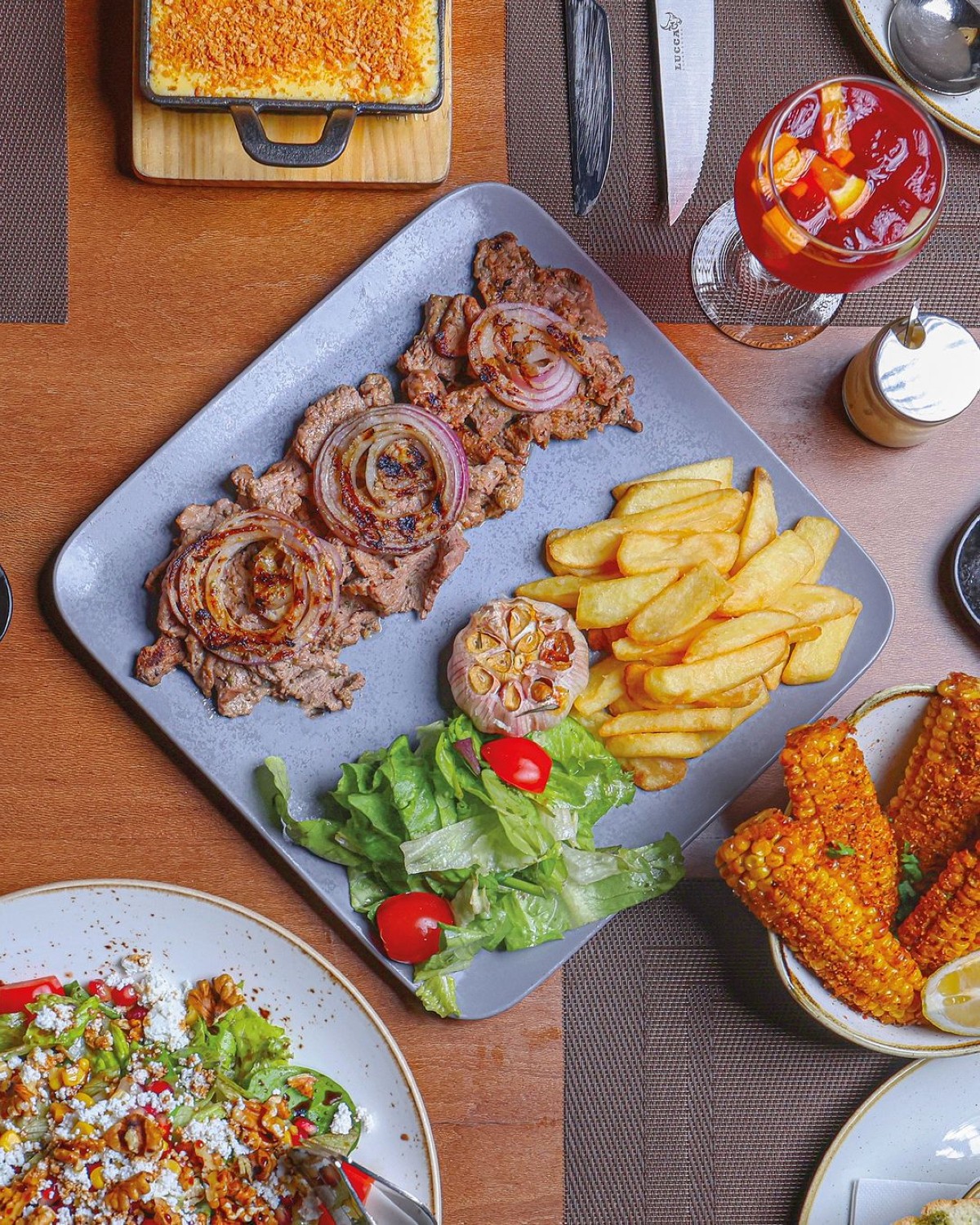 Enjoy a flame-grilled steak in the cosy environs of Lucca 