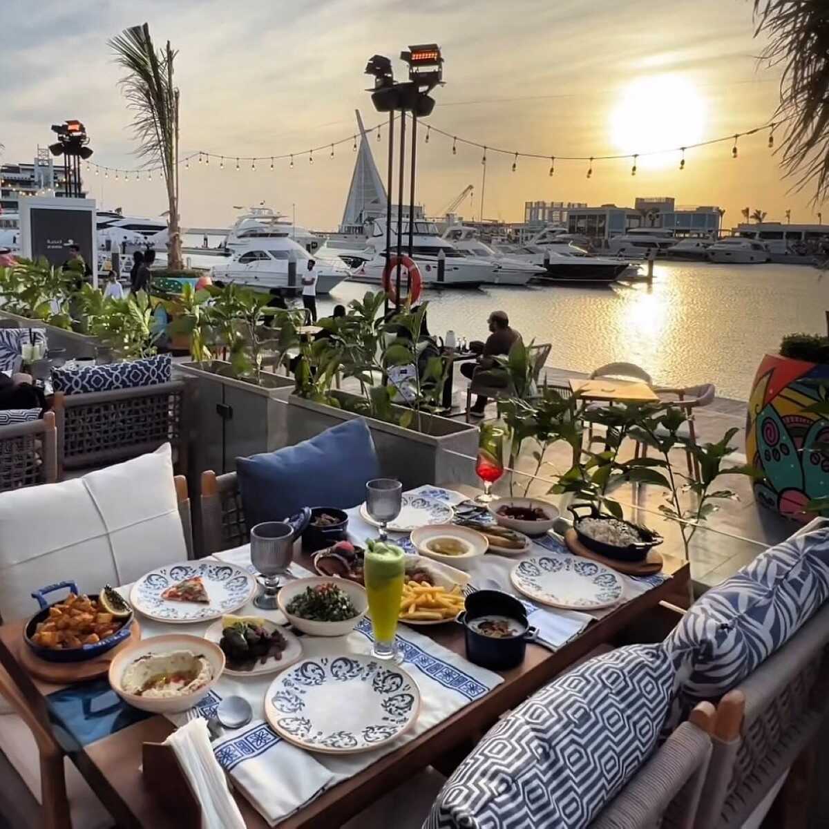 Watch the world go by as the sun sets at Petit Café