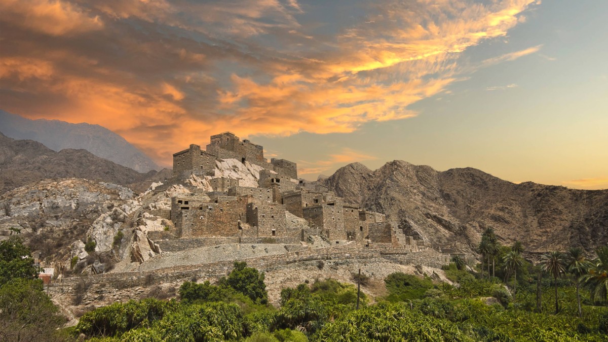Sunset behind the ancient village of Thee Ain. VisitSaudi.com