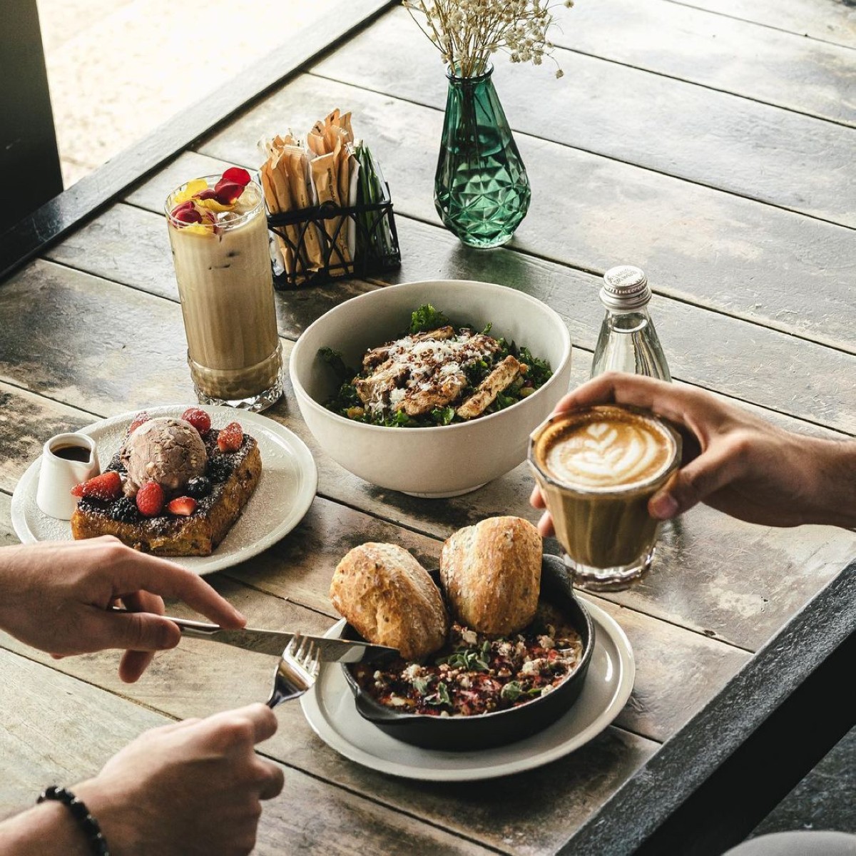 People watch and enjoy delicious food after dark at Bafarat Cafe