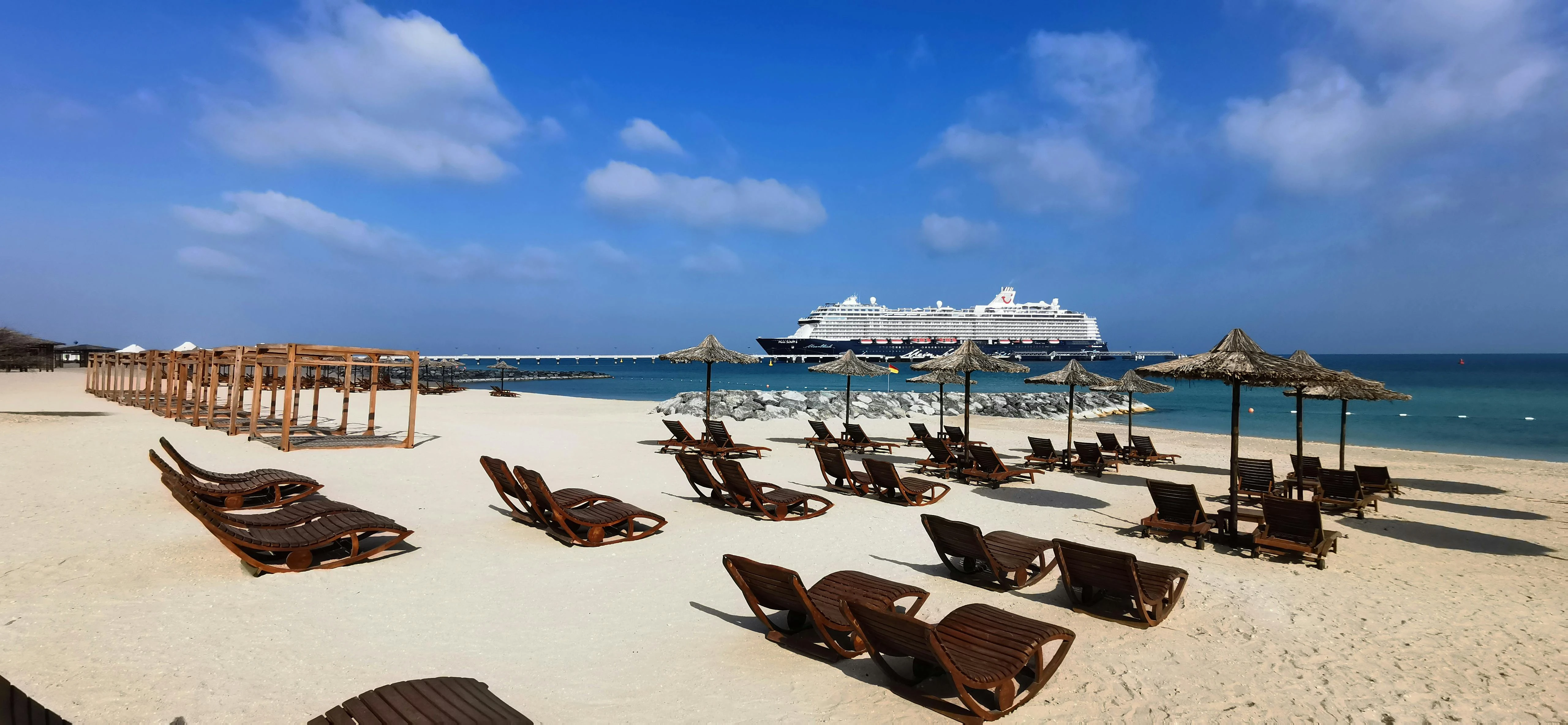 A beach filled with loungers on Bani Yas Island. Pexels