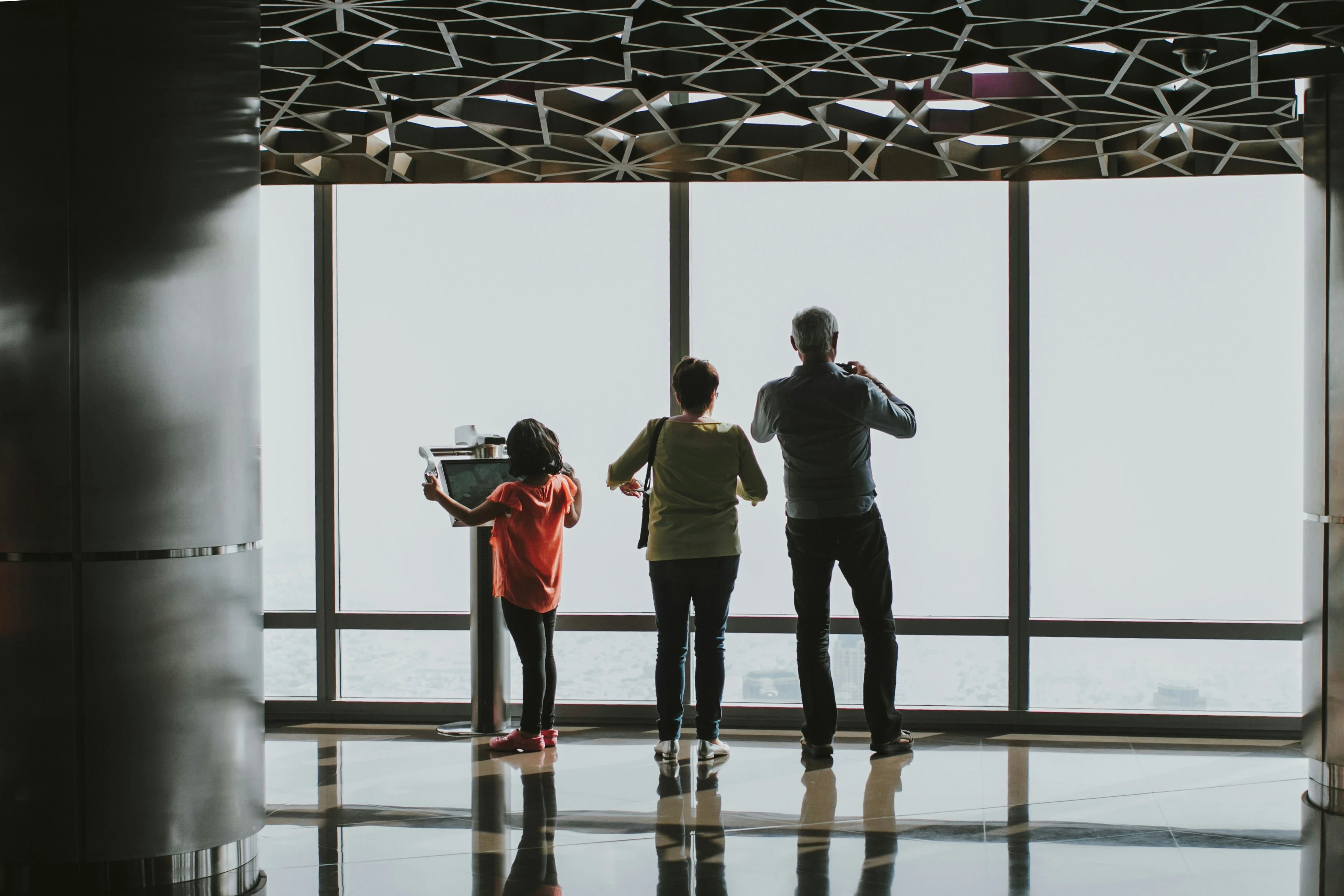 A family on the Burj Khalifa observation deck. Kate Trysh/Unsplash