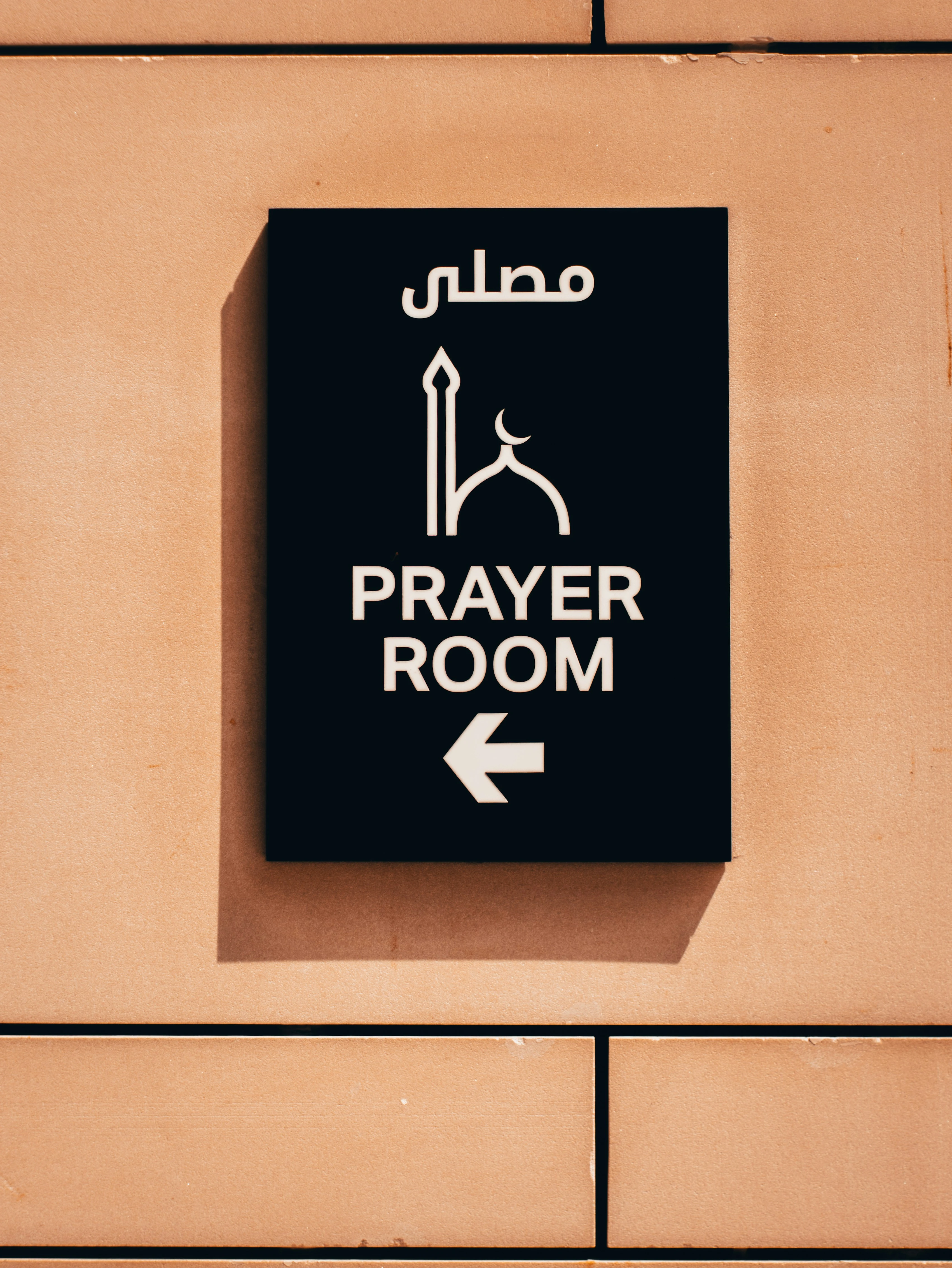 Sign for a prayer room in Dubai. Unsplash
