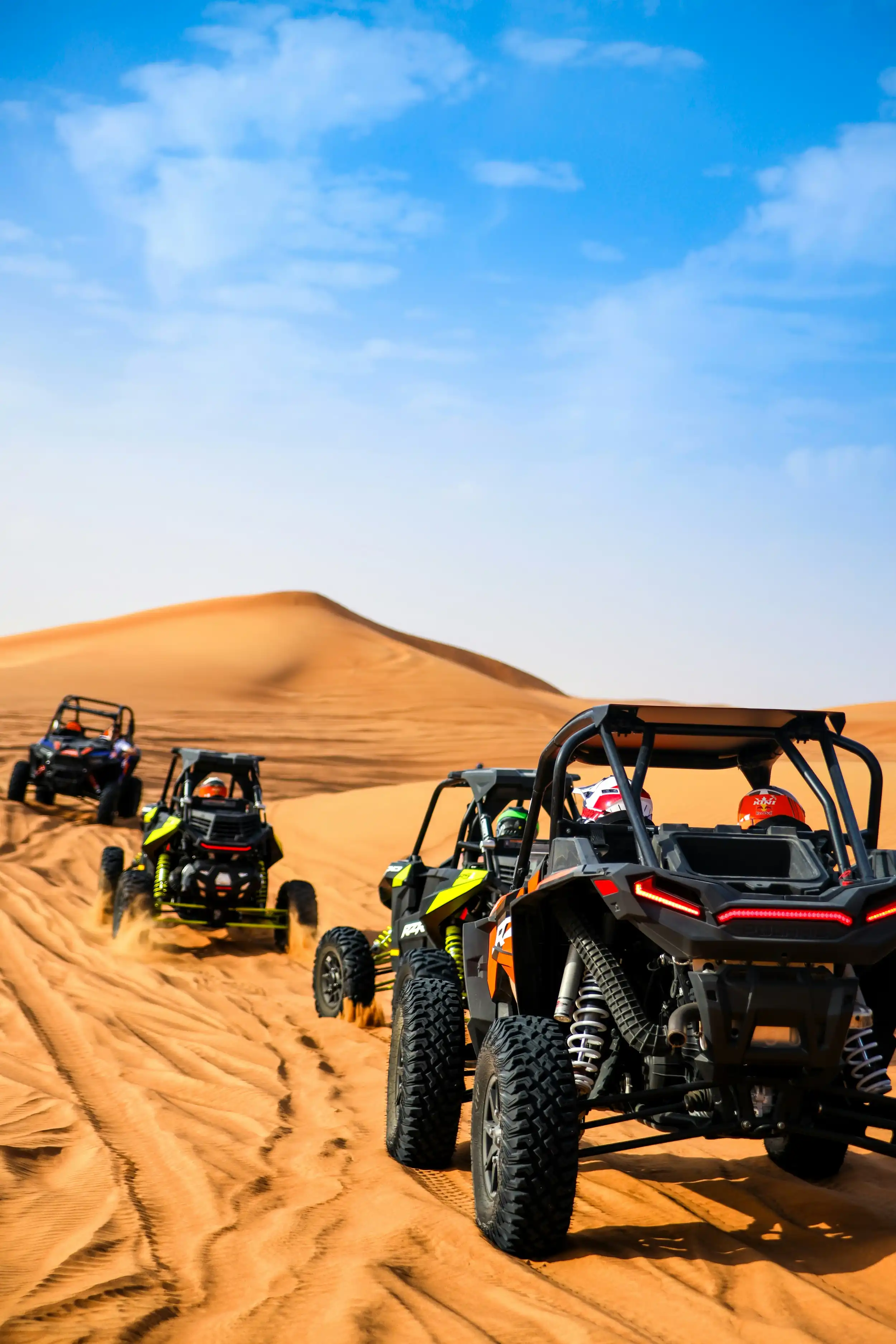 Dune buggies in the Dubai desert. Unsplash