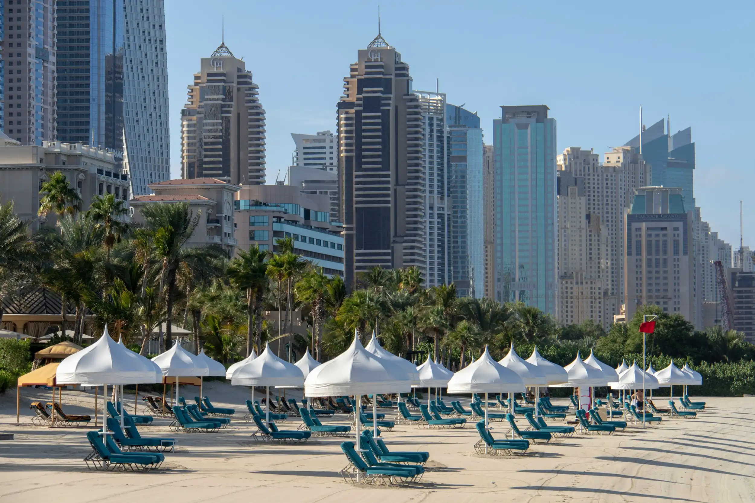 Loungers on the beach in Dubai. Unsplash