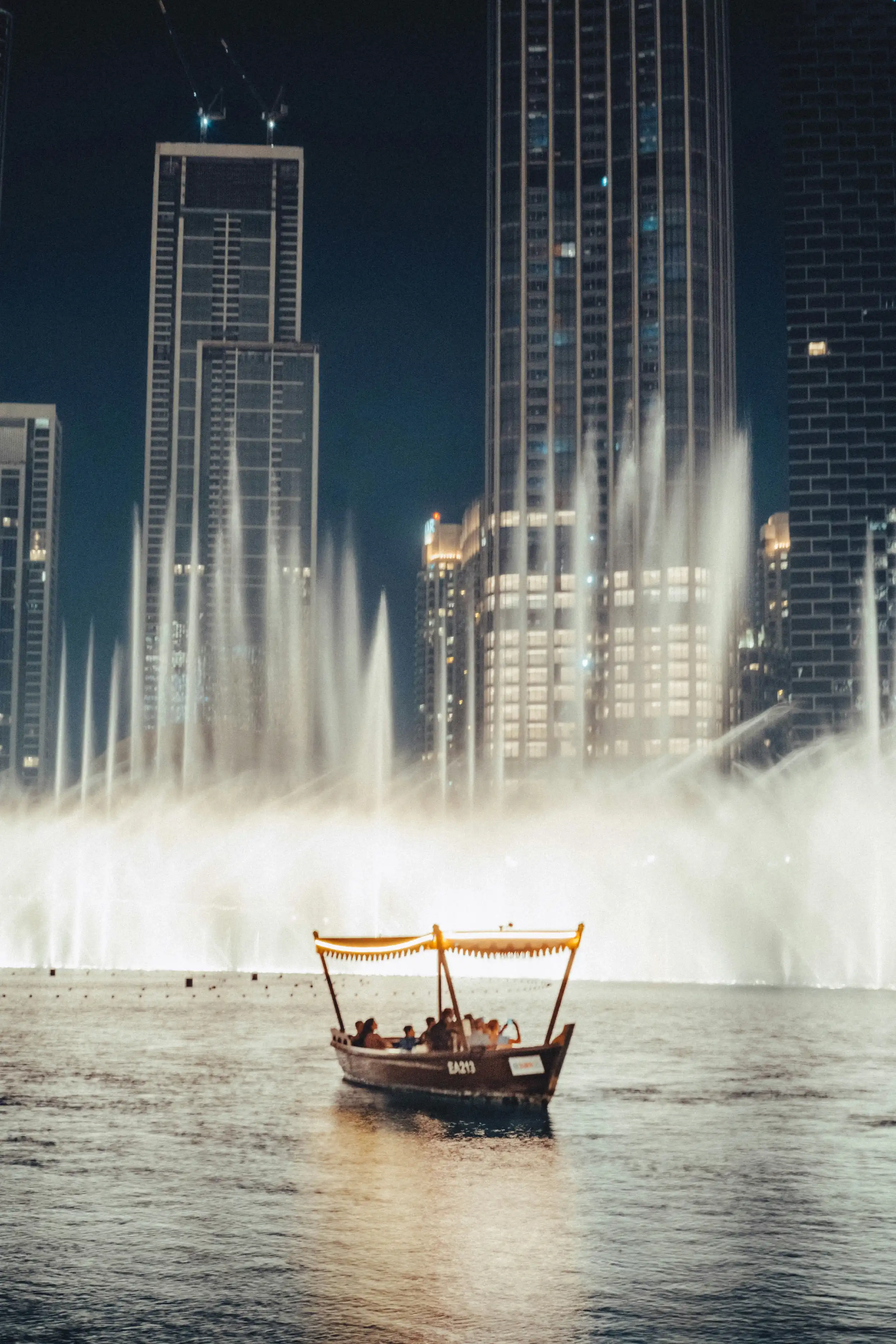 A traditional abra next to the Dubai Fountain