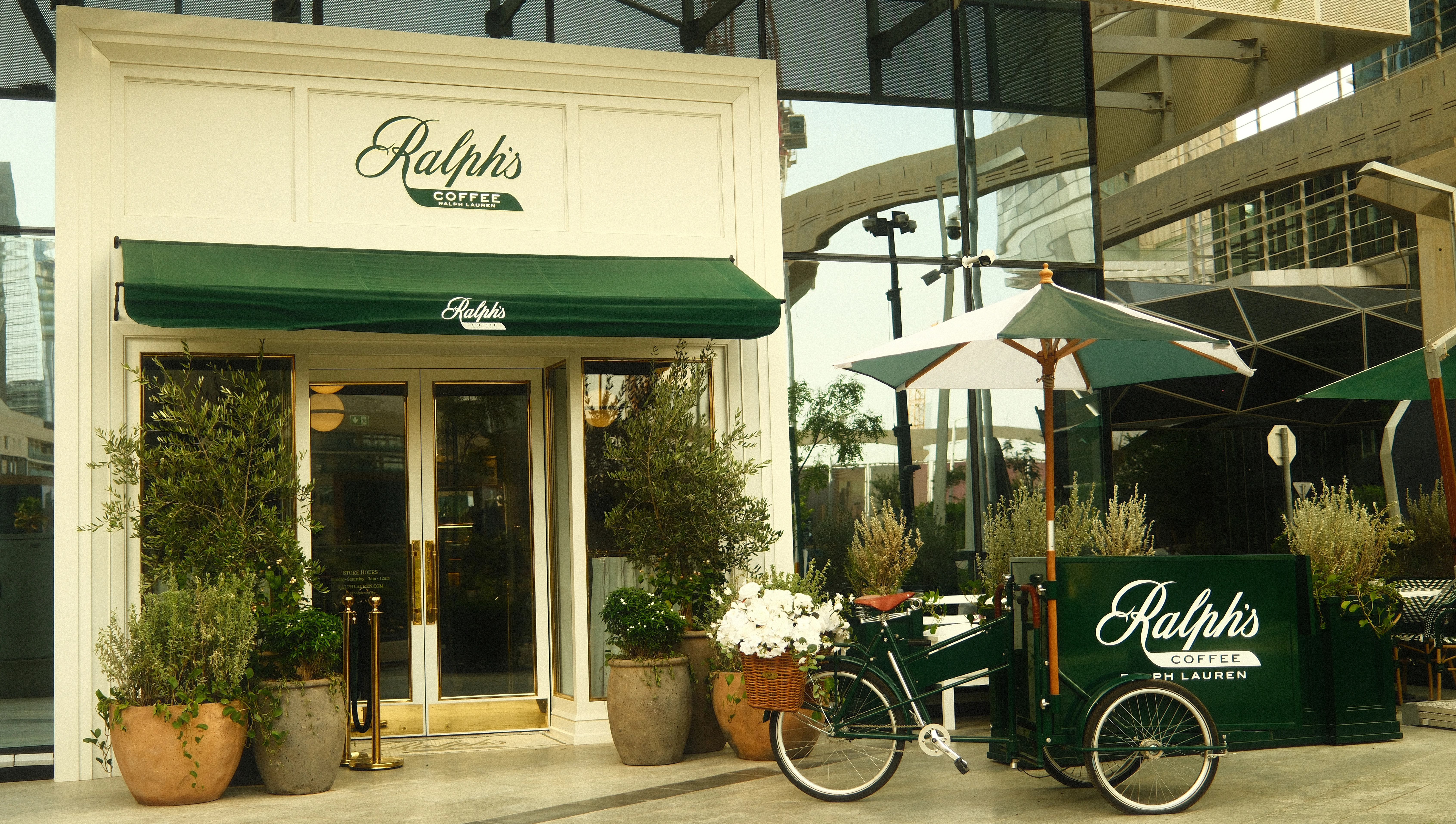 The cream and green exterior of Ralph's Coffee in KAFD, Riyadh.