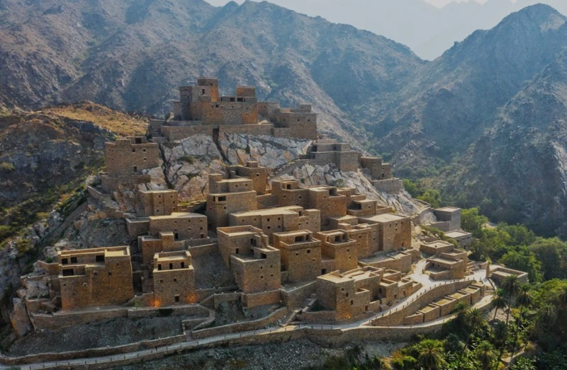Stone buildings hugging the hilltop in Al Baha 
