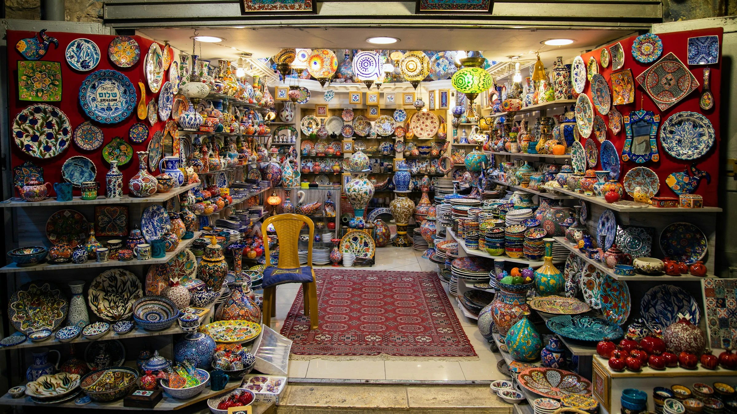 Colourful pottery in a souq. Unsplash